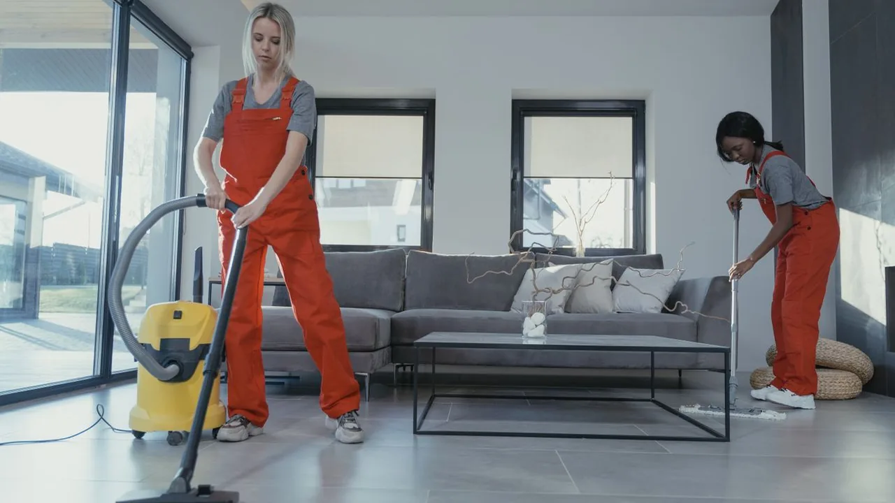 Cleaning team caring for floors in a Seattle living room.